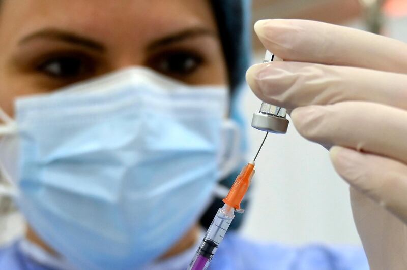 epa09033428 A health worker prepares to inject a dose of the Pfizer-BioNTech COVID-19 vaccine during a nationwide vaccination campaign, at the Saint George Hospital University Medical Center (Al-Roum hospital) at Ashrafieh area in Beirut, Lebanon, 24 February 2021. The World Bank warned that it may halt funding for Lebanonâ€™s COVID-19 vaccination campaign after 16 lawmakers and five of their staff members were vaccinated inside the Lebanese parliament building on 23 February, violating regulations which aim to keep the process fair and transparent.  EPA/WAEL HAMZEH