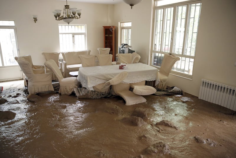A dining room inside a residence at the site of a flash flood in the Iranian village of Zayegan, north of Tehran, on August 2, 2022.  EPA