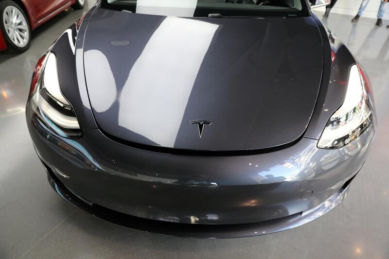 FILE PHOTO: A Tesla Model 3 is seen in a showroom in Los Angeles, California, U.S. January 12, 2018. REUTERS/Lucy Nicholson/File Photo