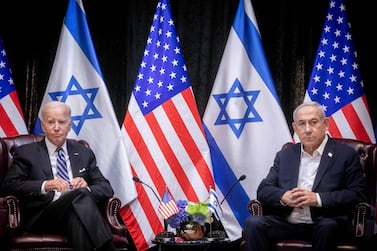 US President Joe Biden (L), sits with Israeli Prime Minister Benjamin Netanyahu, at the start of the Israeli war cabinet meeting, in Tel Aviv on October 18, 2023, amid the ongoing battles between Israel and the Palestinian group Hamas.  US President Joe Biden landed in Tel Aviv on October 18, 2023 as Middle East anger flared after hundreds were killed when a rocket struck a hospital in war-torn Gaza, with Israel and the Palestinians quick to trade blame.  (Photo by Miriam Alster  /  POOL  /  AFP)