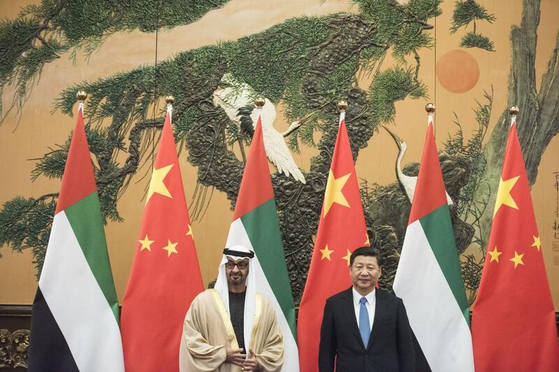 Sheikh Mohammed bin Zayed, Crown Prince of Abu Dhabi and Deputy Supreme Commander of the Armed Forces, poses with Chinese President Xi Jinping during their meeting at the Great Hall of the People in Beijing, China. Fred Dufour / EPA / Pool Pool