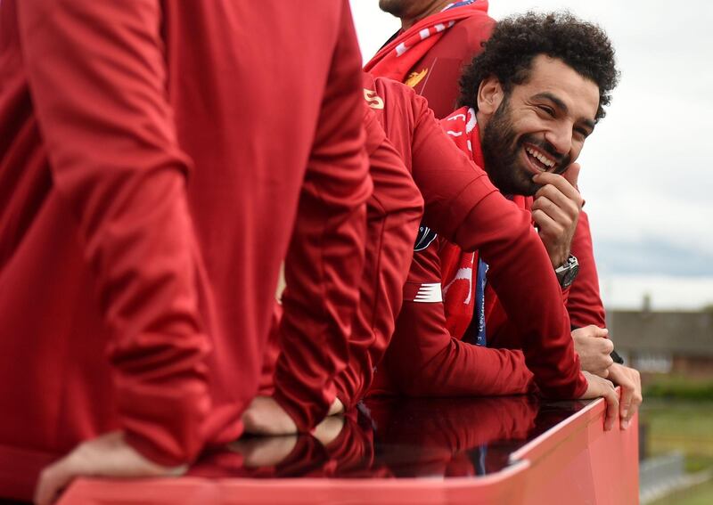 Mohamed Salah reacts during the open-top bus parade around Liverpool. AFP