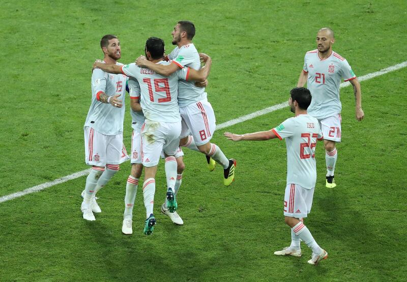 Spain celebrate Diego Costa scoring his second goal, leveling the score once again at 2-2. Lucy Nicholson / Reuters