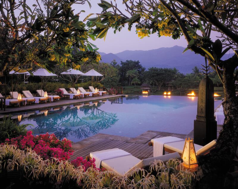 A handout photo of twilight shot of the pool at Four Seasons Chiang Mai (Photo by Robert Miller)