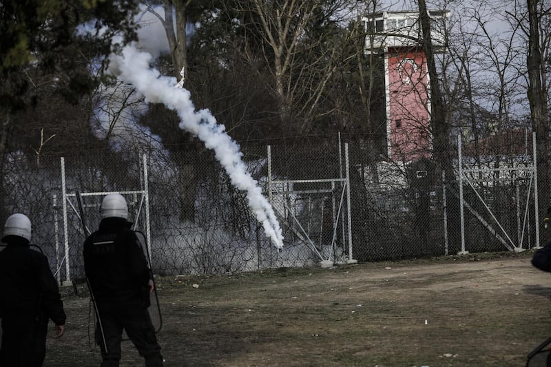 Greek riot police and the army hold positions as migrants toss rocks and other projectiles on the Greek-Turkish border gate in Kastanies, Greece. Getty Images