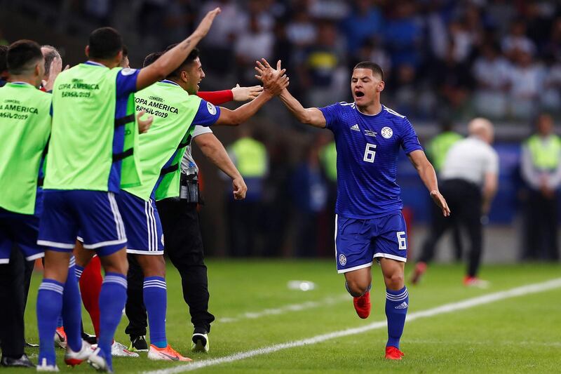 Paraguay's Richard Sanchez, right, celebrates after scoring against Argentina. Reuters