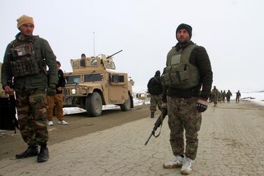 Afghan National Army forces go towards the site of an airplane crash in Deh Yak district of Ghazni province, Afghanistan January 27, 2020. REUTERS/Mustafa Andaleb