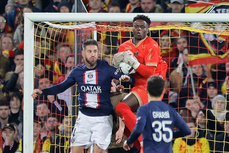 PSG's Sergio Ramos in action with Lens' Brice Samba. Reuters