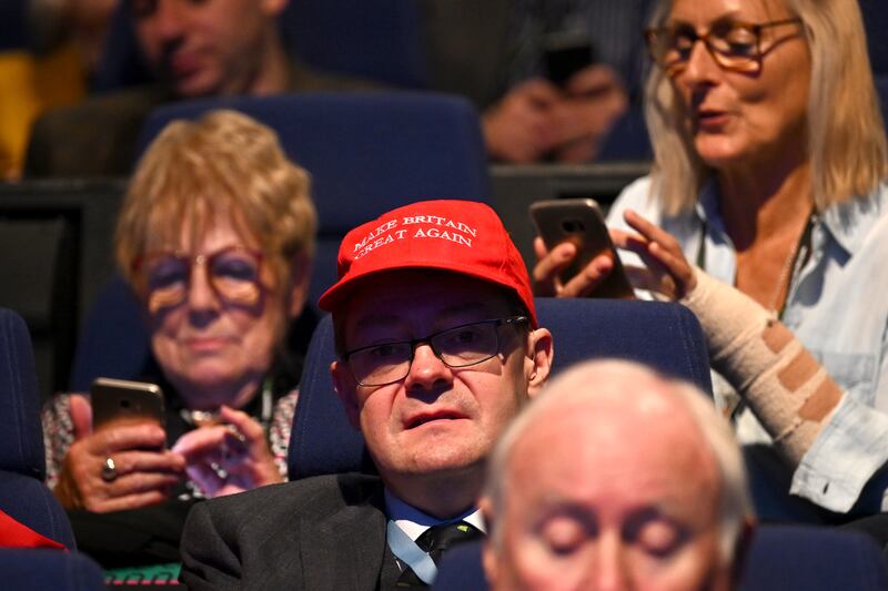 A delegate wears a red 'Make Britain Great Again' cap. Getty Images