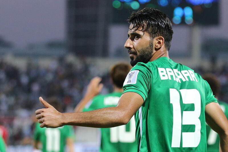 Bashar Resan Bonyan, centre, of Iraq celebrates scoring his country's second goal. EPA