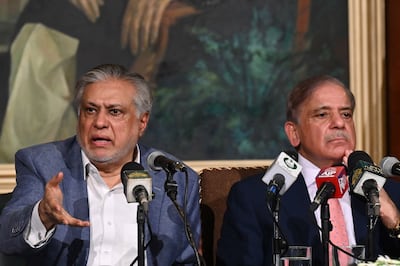 Pakistan's Prime Minister Shehbaz Sharif, right, and Pakistan's Finance Minister Ishaq Dar address a press conference in Lahore on June 30 after the agreement with the IMF was signed. AFP