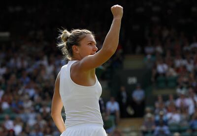 Simona Halep of Romania celebrates winning the first set from Zheng Saisai of China during their men's singles match on the fourth day at the Wimbledon Tennis Championships in London, Thursday July 5, 2018. (AP Photo/Kirsty Wigglesworth)