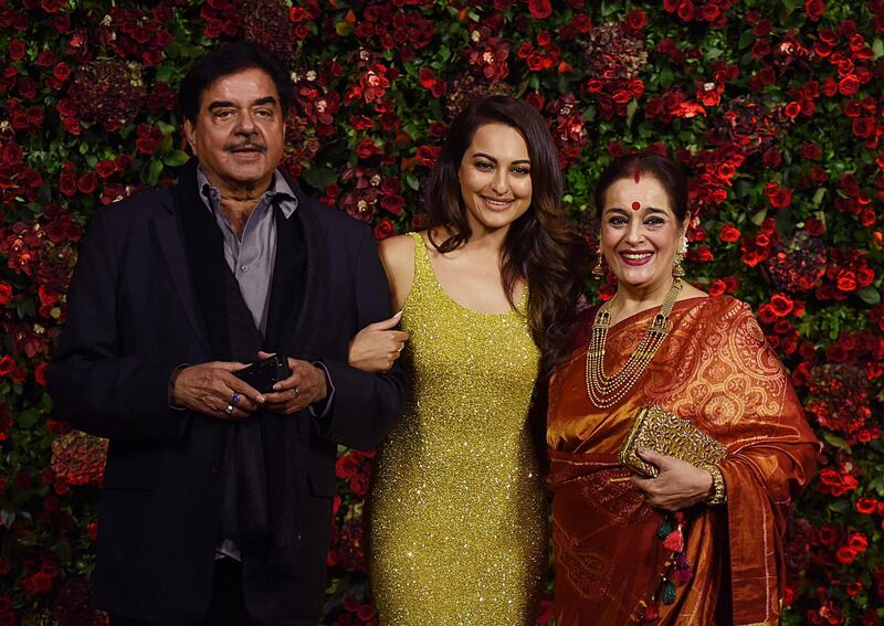 Shatrughan Sinha, Sonakshi Sinha and Poonam Sinha. AFP