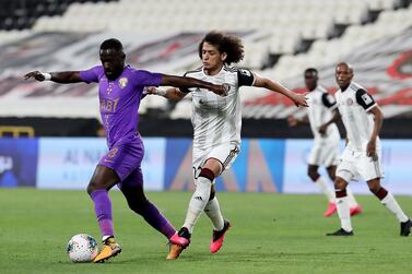 ABU DHABI, UNITED ARAB EMIRATES , March 14 – 2020 :- Ahmed Barman (no 13 purple) of Al Ain and Omar Abdulrahman (no 21 white) of Al Jazira in action during the Arabian Gulf League football match between Al Jazira v Al Ain held at Mohamed bin Zayed Stadium in Abu Dhabi. (Pawan Singh / The National) For Sports. Story by John