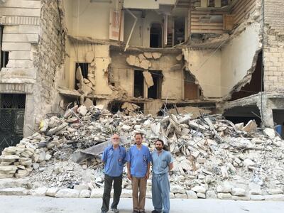 Dr Zaher Sahloul, centre, with colleagues in Syria. Courtesy Zaher Sahloul