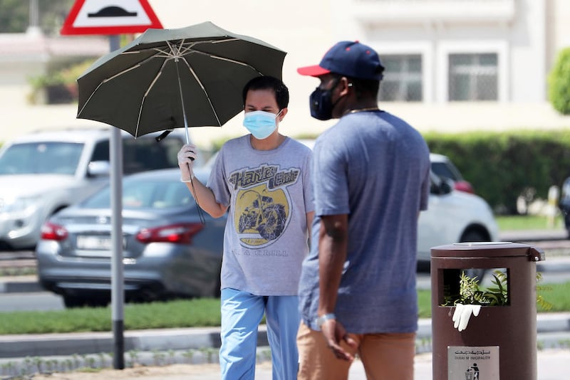 DUBAI, UNITED ARAB EMIRATES , October 3 – 2020 :- People wearing protective face mask and gloves as a preventive measure against the spread of coronavirus in Bur Dubai area in Dubai. (Pawan Singh / The National) For News/Stock/Online.