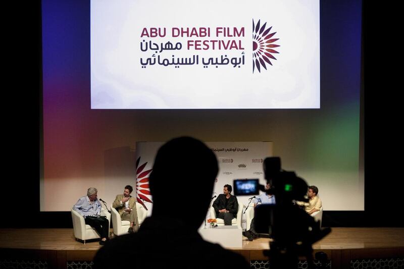 From left, Christopher Dodd, Adrien Brody, Kyle Mann, and a producer of the film, “Wrecked”, discuss cinema at a Q and A for atendees of the Abu Dhabi Film Festival. Lee Hoagland/ The National