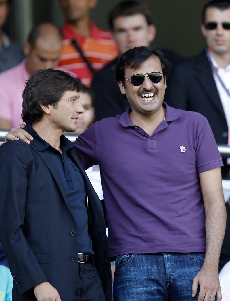 Brazilian's PSG manager Leonardo, left, is seen  with new club owner, Qatar's Crown Prince Sheikh Tamim Bin Hamad Al Thani prior to  the French League one soccer match at the Parc des Princes, in Paris, Sunday, Aug. 21, 2011. (AP Photo/Jacques Brinon) *** Local Caption ***  France Soccer.JPEG-047a0.jpg