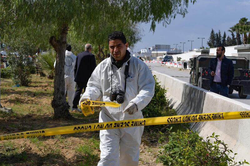 A forensic expert seals off the scene of an explosion near the US embassy in Tunis. AFP