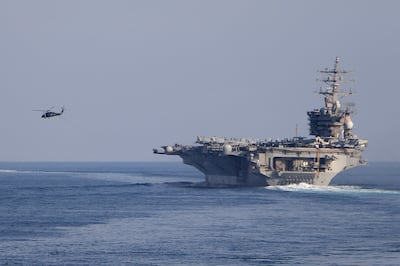 The USS Eisenhower transits the Strait of Hormuz in November 2023 but is returning home later this year. AFP