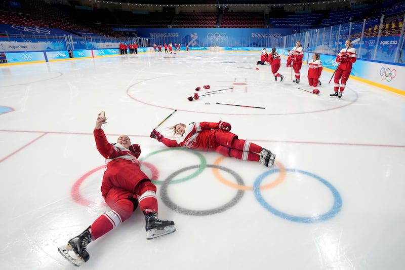 Players of Denmark's women's ice hockey team pose for a photo at the 2022 Winter Olympics. AP 