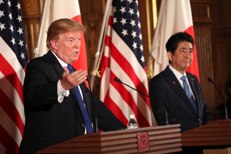 US president Donald Trump, left, speaks as Japanese prime minister Shinzo Abe, right, looks on during a joint news conference at the Akasaka Palace in Tokyo. Trump is on a five-country trip through Asia traveling to Japan, South Korea, China, Vietnam and the Philippines. Andrew Harnik / AP Photo