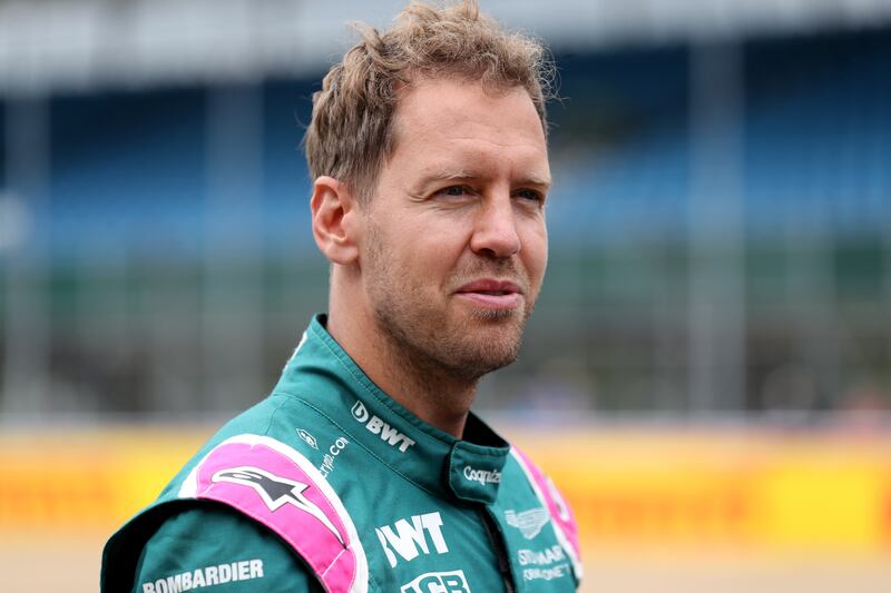Aston Martin's Sebastian Vettel has yet to test negative for Covid-19. PA