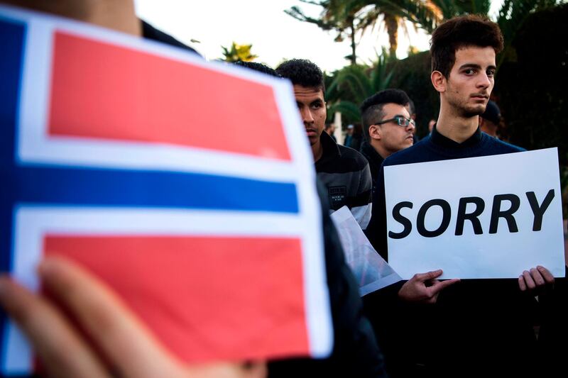 Moroccans pay tribute to murdered Danish Louisa Vesterager Jespersen and Norwegian Maren Ueland in Rabat, in front the Norwegian ambassy on December 22, 2018. Crowds of Moroccans gathered on December 22 to mourn two Scandinavian hikers brutally murdered by suspected jihadists in the High Atlas mountains. Hundreds of people paid tribute to Danish student Louisa Vesterager Jespersen, 24, and 28-year-old Norwegian Maren Ueland outside the embassies of their homelands in the capital Rabat. / AFP / FADEL SENNA
