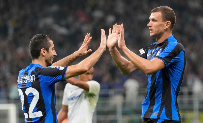 Edin Dzeko, right, celebrates with Henrikh Mkhitaryan after scoring Inter's third goal. AP