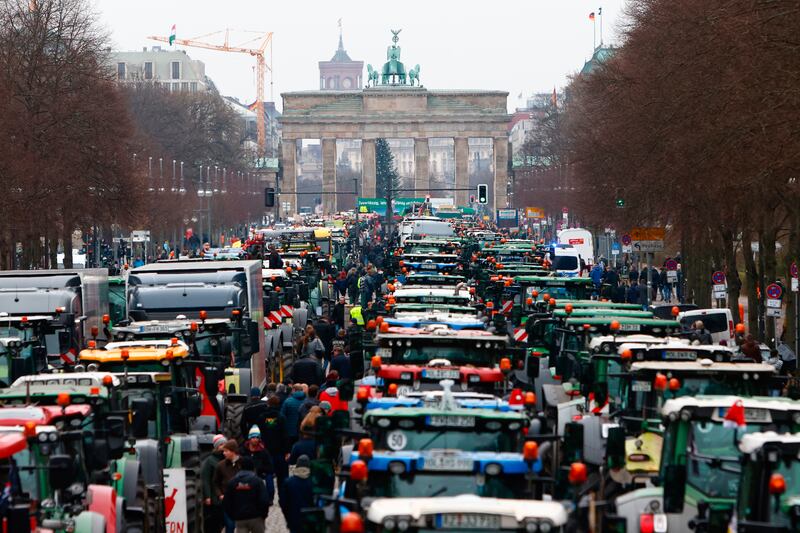 Farmers at the Brandenburg Gate in Berlin protest against planned cuts to fuel subsidies. Getty Images