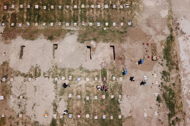 An aerial view of the Covid-19 burial section of the La Bermeja cemetery, in San Salvador, El Salvador. El Salvador marked one year since the first death due to the coronavirus was reported, To date the country's toll has exceeded 2,000, according to official figures. EPA