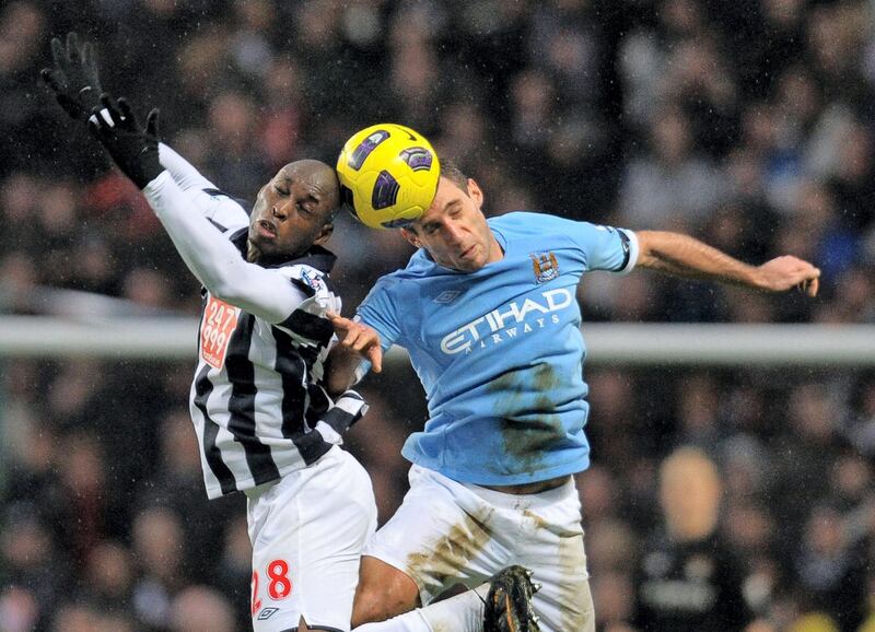 Manchester City's Argentian defender Pablo Zabaleta (R) Whole-hearted right-back who signed for City a day before the takeover and became a mainstay of the side and fan favourite. Featured in two title successes before joining West Ham in 2017.  AFP PHOTO 