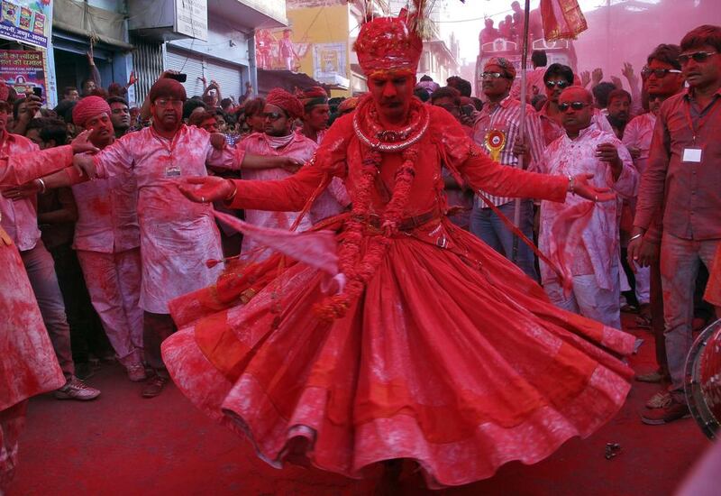 A man dances as he takes part in a colourful procession locally known as ‘Badshah ki Sawari’ as part of Holi celebrations in Beawar. Himanshu Sharma / Reuters