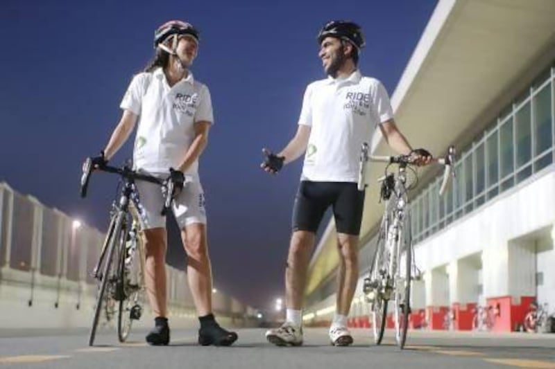 Sara Coppo of Italy and Emirati Faisal Al Reyaysa, Etisalat workers living in Dubai, have qualified for a 2,100km, 13-day tour from Brussels to Barcelona that will test both their endurance, and a mobile-phone monitoring and management system for diabetics. Lee Hoagland / The National