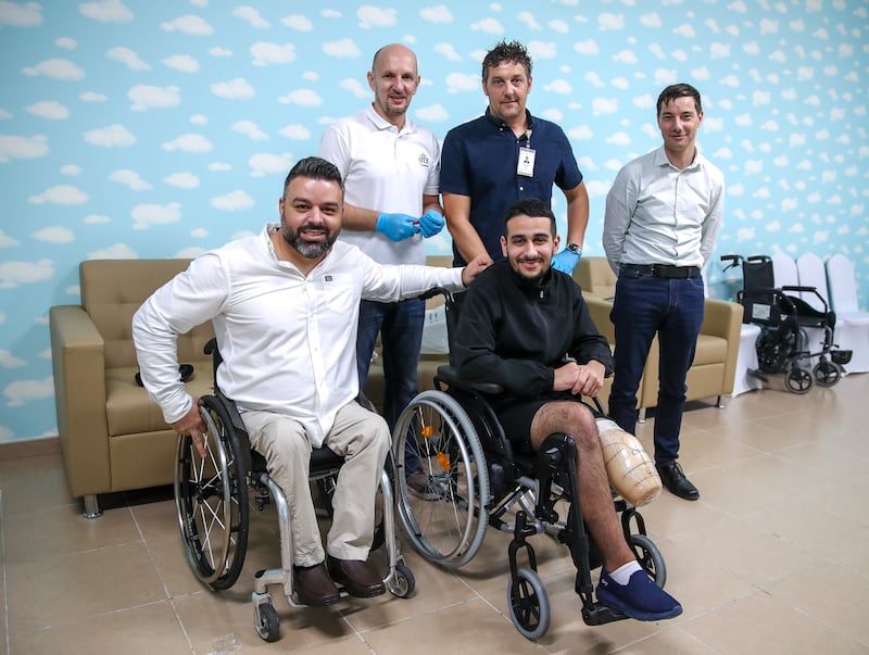 Mohamed Elmadhoun, 18, front row right, had a prosthetic leg fitted at Emirates Humanitarian City. The Palestinian teenager lost his limb in violence in Gaza. All photos: Victor Besa / The National