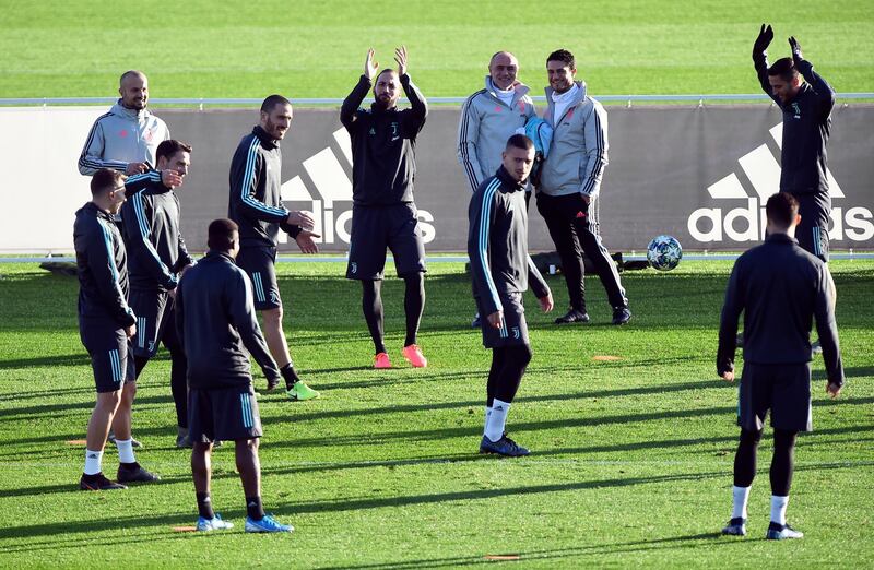 Juventus' Gonzalo Higuain, Leonardo Bonucci and teammates during training. Reuters