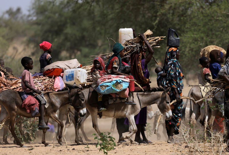 Sudanese refugees fleeing the violence in the western Darfur Region cross the border into Chad. Reuters