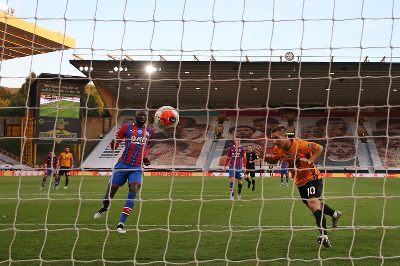 Wolverhampton Wanderers' Daniel Podence, centre, celebrates scoring the opening goal. AFP