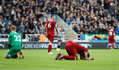 Soccer Football - Premier League - Newcastle United vs Liverpool - St James��� Park, Newcastle, Britain - October 1, 2017   Liverpool's Simon Mignolet and Joel Matip looks dejected after Newcastle United's Joselu scores their first goal    Action Images via Reuters/Carl Recine  EDITORIAL USE ONLY. No use with unauthorized audio, video, data, fixture lists, club/league logos or "live" services. Online in-match use limited to 75 images, no video emulation. No use in betting, games or single club/league/player publications. Please contact your account representative for further details.