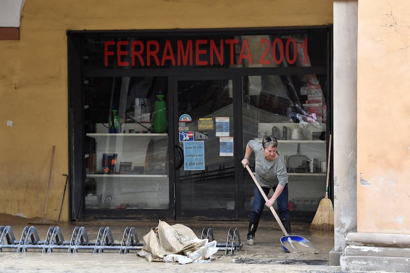 Clearing up a shop in Castel Bolognese. Reuters