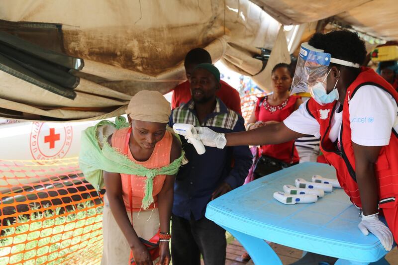 epa07645050 A handout photo made available by the World Health Organization (WHO) shows temperature screening at Mpondwe border point with DR Congo, near Bwera, Uganda, 09 May 2019 (issued 13 June 2019).  The WHO has confirmed a case of Ebola virus disease outbreak in Uganda.  EPA/WORLD HEALTH ORGANIZATION HANDOUT  HANDOUT EDITORIAL USE ONLY/NO SALES
