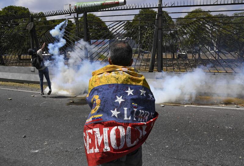 Opposition demonstrators clash with soldiers loyal to Mr. Maduro. AFP