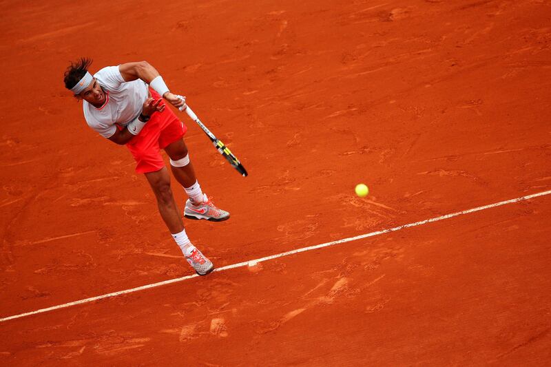 PARIS, FRANCE - JUNE 09:  Rafael Nadal of Spain serves during the Men's Singles final match against David Ferrer of Spain on day fifteen of the French Open at Roland Garros on June 9, 2013 in Paris, France.  (Photo by Clive Brunskill/Getty Images) *** Local Caption ***  170234450.jpg