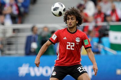 FILE - In this Friday, June 15, 2018 file photo, Egypt's Amr Warda watches the ball during their group A match against Uruguay at the 2018 soccer World Cup in the Yekaterinburg Arena in Yekaterinburg, Russia. Egypt has expelled midfielder Amr Warda from its squad for the rest of the African Cup of Nations for a beach of discipline after he allegedly sexually harassed women on social media. The Egyptian Football Association said Wednesday, June 26, 2019 and just hours before the host's game against Congo that Warda had been thrown out in order to maintain "discipline, commitment and focus" in the team.(AP Photo/Mark Baker, file)
