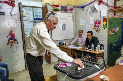 March 27, 2018 -- Cairo-- A man casts his ballot at a polling station in Shubra on the second day of voting. (Dana Smillie for The National)