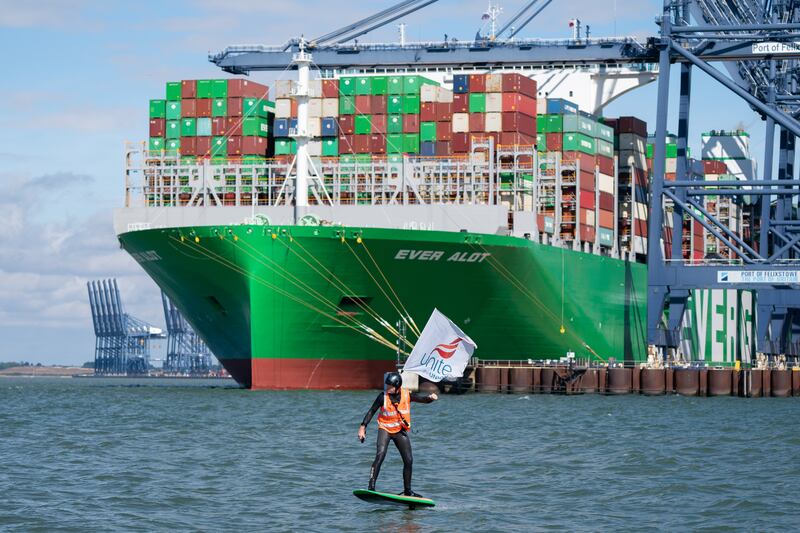 A port worker surfs at the Port of Felixstowe, Britain's biggest and busiest container terminal, on Wednesday after members of the Unite union went on strike. PA
