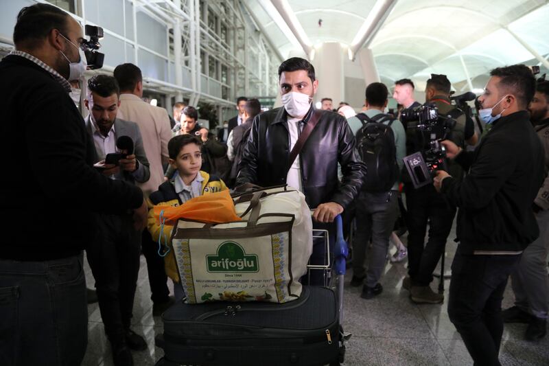 Iraqi migrants arrive at the airport in Erbil, capital of Iraq's Kurdish region, where a repatriation flight from Belarus made a stop before proceeding to Baghdad. AP Photo