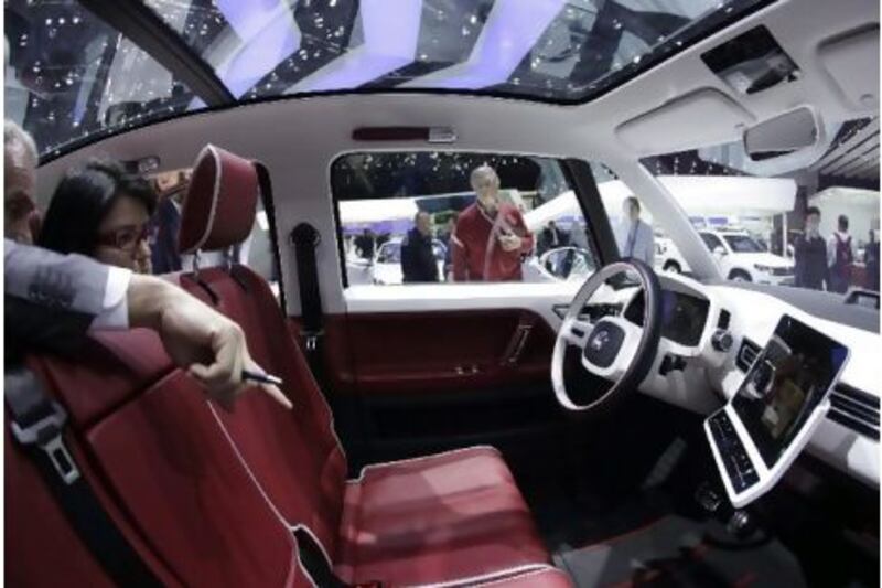 Visitors inspect the interior of the new VW Bully concept car at the 81st Geneva Motor Show. 
Denis Balibouse / Reuters