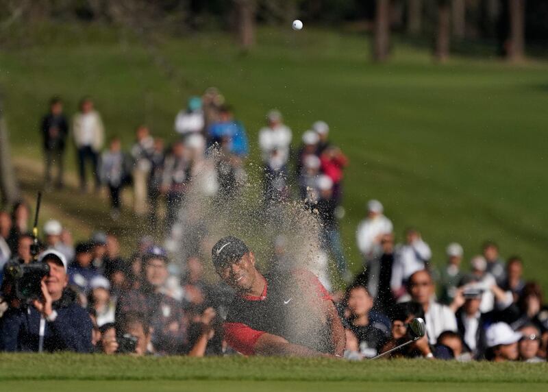 Tiger Woods of the United States hits a shot out of a bunker on the 18th hole during the final round of the Zozo Championship in Japan, on Monday, October 28. The American claims 82nd Tour victory with three-shot win. AP