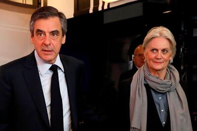 (FILES) In this file photo taken on March 20, 2017 French presidential election candidate for the right-wing Les Republicains (LR) party Francois Fillon (L), with his wife Penelope Fillon (R), arrives for a debate organised by French private TV channel TF1 in Aubervilliers, outside Paris.       From February 24, 2020, French former premier Francois Fillon and his wife will go on trial over a fake jobs scandal. Fillon crashed out of the running for the presidency in 2017 after being charged with using public funds to pay his wife for a fake job as his assistant. / AFP / POOL / Patrick KOVARIK
